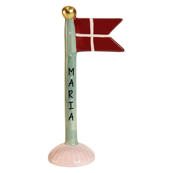 Grön stång med vita prickar, guldfärgad topp, röd/vit flagga, rosa bas, namn "Maria".